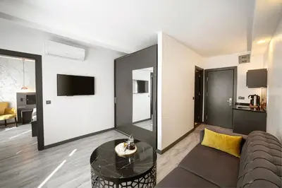 a living room with a couch and a table at Taksim Seya Suites Hotel in Istanbul