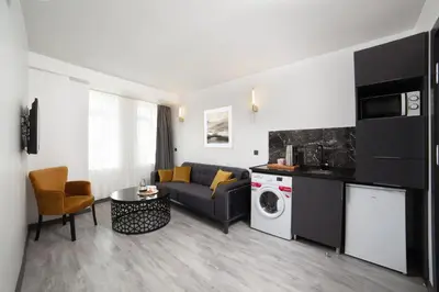 a living room with a couch and a table at Taksim Seya Suites Hotel in Istanbul