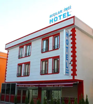 a white building with a hotel sign on it at Avcılar İnci Hotel in Istanbul