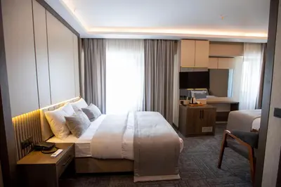 a hotel room with a bed and a desk at THE GREEN HOTEL in Istanbul