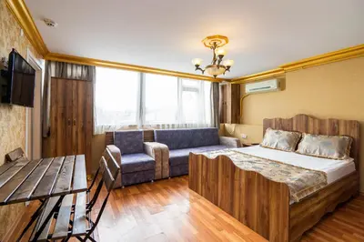 a living room with a bed and a couch at Kervanchi in Istanbul
