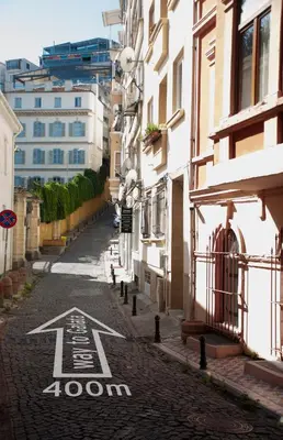 a street with a arrow painted on the road at Reu de Hotel in Istanbul