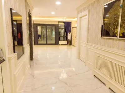 a hallway of a building with a tile floor at Bursa Ulupark Hotel in Bursa