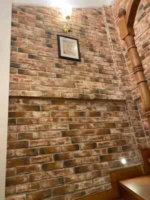 a brick wall with a picture on it at Bosphorus Bridge in Istanbul
