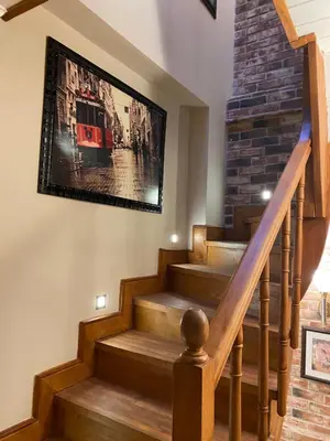 a staircase in a house with a painting on the wall at Bosphorus Bridge in Istanbul