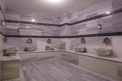 a bathroom with three sinks in a room at Hotel BFC Spa & Sport in Bursa
