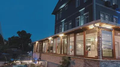 a building with glass windows on the side of it at Royal Park Hotel Corlu Bed and Breakfast in Tekirdag