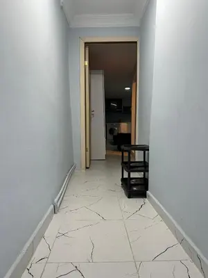 an empty room with a hallway with a tile floor at AWWA APART HOTEL in Istanbul