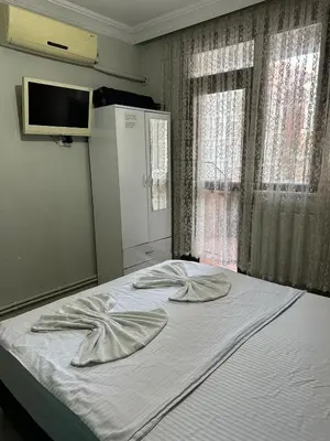 a bed with two pillows on it in a bedroom at AWWA APART HOTEL in Istanbul