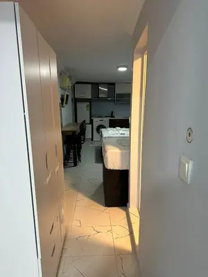 a hallway with a room with a bed and a table at AWWA APART HOTEL in Istanbul