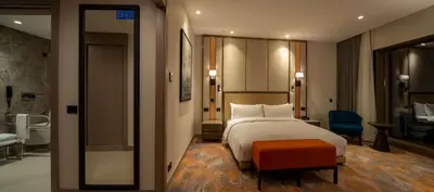 a hotel room with a bed and a bathroom at Hilton Mall Of Istanbul in Istanbul