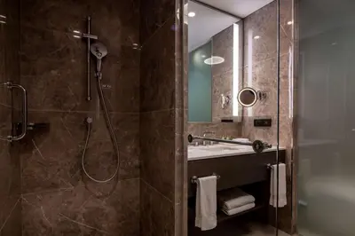 a bathroom with a shower and a sink at Hilton Mall Of Istanbul in Istanbul