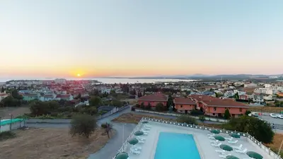 arial view of a villa with a swimming pool and a city at DOUBLE ROYAL HOTEL in Kocaeli