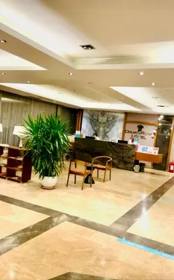 a lobby of a hotel with a table and chairs at DOUBLE ROYAL HOTEL in Kocaeli