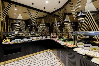 a buffet line with many different types of food at Ramada by Wyndham Istanbul Golden Horn in Istanbul