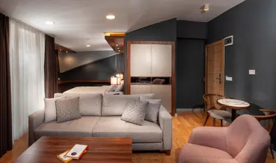 a living room with a couch and a bed at Vitabella Suites in Istanbul