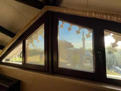 a window with a view of a building at Antik Konak Little Hagia Sophia Suites in Istanbul