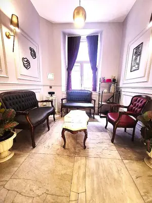 a living room with couches and a coffee table at The Independent Hotel Taksim in Istanbul