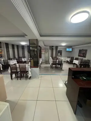 a dining room with tables and chairs and a ceiling at GRAND VATAN HOTEL in Istanbul