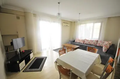 a living room with a table and a couch at Apart Point in Istanbul