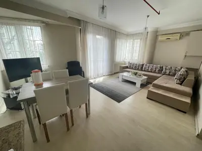 a living room with a table and a couch at Apart Point in Istanbul
