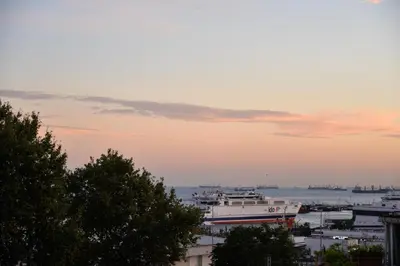 a boat is docked in a harbor at sunset at Hotel Orkide in Istanbul