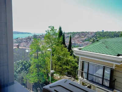 a balcony of a house with a view of a city at Class Hotel Bosphorus With Jacuzzi in Istanbul
