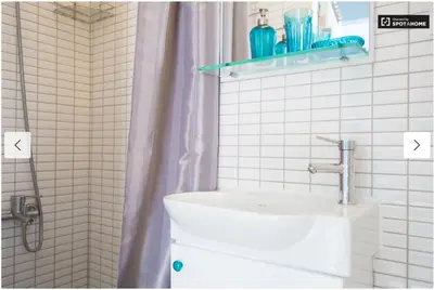 a bathroom with a toilet and a shower with a sink at Blue Apartment in Istanbul