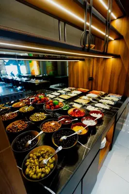 a buffet line with many different types of food at Continent Luxury Suites Sakarya in Sakarya