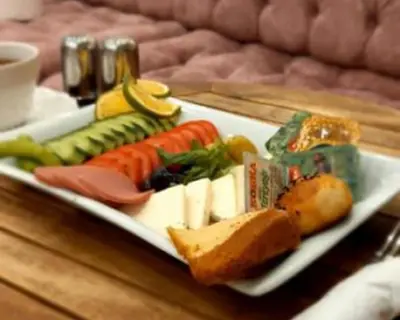 a plate of vegetables and bread on a table at Siesta Premium Hotel in Istanbul