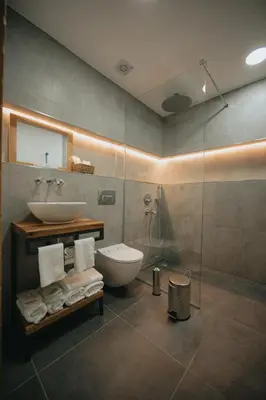 a bathroom with a sink and a toilet and a shower at Büyükada Loc'ada in Adalar