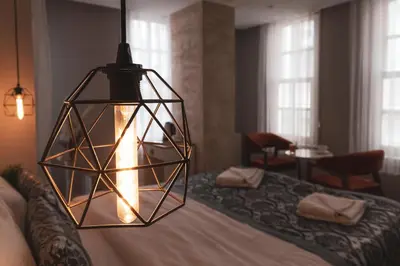 a pendant light hanging over a bed in a room at Galata Door Hotel in Istanbul