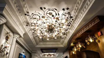 a chandelier hanging from a ceiling in a building at Arach Hotel Harbiye in Istanbul