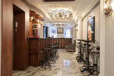 a room with a row of chairs and a bar at Arach Hotel Harbiye in Istanbul
