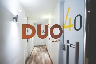 a sign for a drug store in a hallway at Duo Galata Hotel in Istanbul