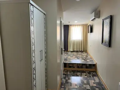 a hallway with a glass door and a tile floor at King Istanbul Hotel in Istanbul