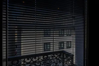 a view of a tall building through a window at Confores Hotel in Istanbul