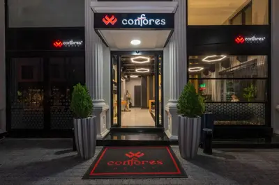 a entrance to a store with a sign on the door at Confores Hotel in Istanbul