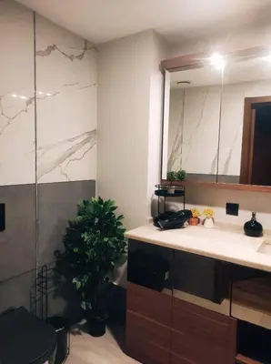 a bathroom with a sink and a mirror at SABİHA GOKCEN İSTANBUL HOUSES Airport in Istanbul