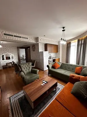 a living room with a couch and a coffee table at SABİHA GOKCEN İSTANBUL HOUSES Airport in Istanbul