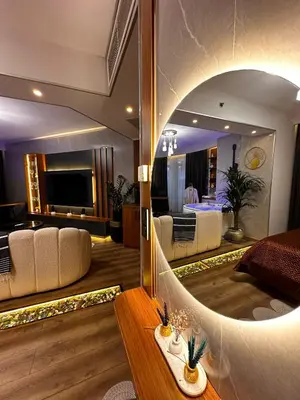 a living room with a large mirror in a room at SABİHA GOKCEN İSTANBUL HOUSES Airport in Istanbul