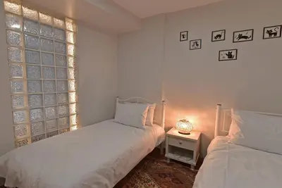 a bedroom with two beds and a window at Duru Istanbul Apart in Istanbul
