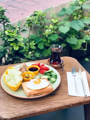 a plate of food with an egg and vegetables on a table at Le Banc in Istanbul