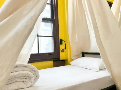 a bed in a room with a window at Le Banc in Istanbul