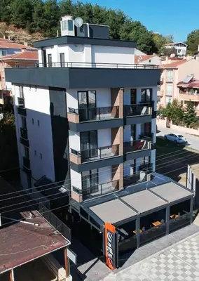a building with a clock tower on top of it at MOPE Hotel in Tekirdag