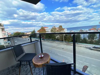 a balcony with a table and chairs and a view of a street at MOPE Hotel in Tekirdag