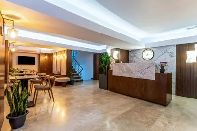 a lobby of a hotel with a table and chairs at Union Hotel Port in Istanbul