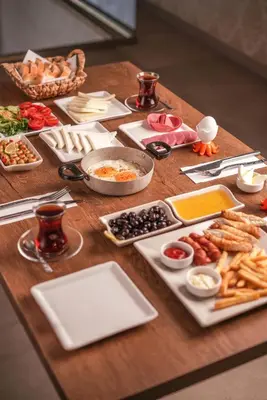 a wooden table with food on top of it at Arsisa in Avcılar