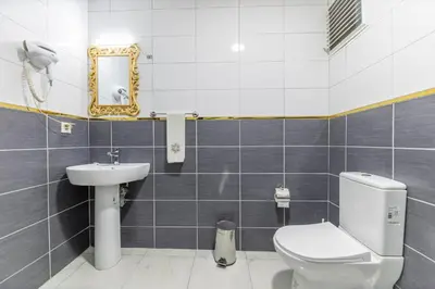 a bathroom with a toilet and a sink at HOTEL ÜMİT YENİKAPI in Istanbul