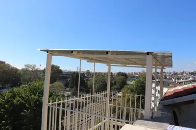 a pergola on the roof of a building at HOTEL ÜMİT YENİKAPI in Istanbul